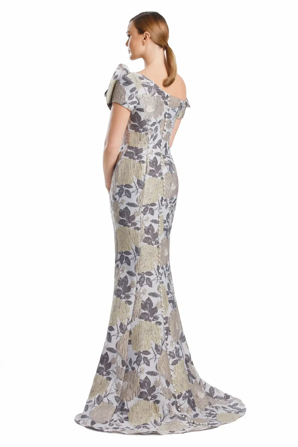 A woman in a floral off-the-shoulder gown with a fitted silhouette.
