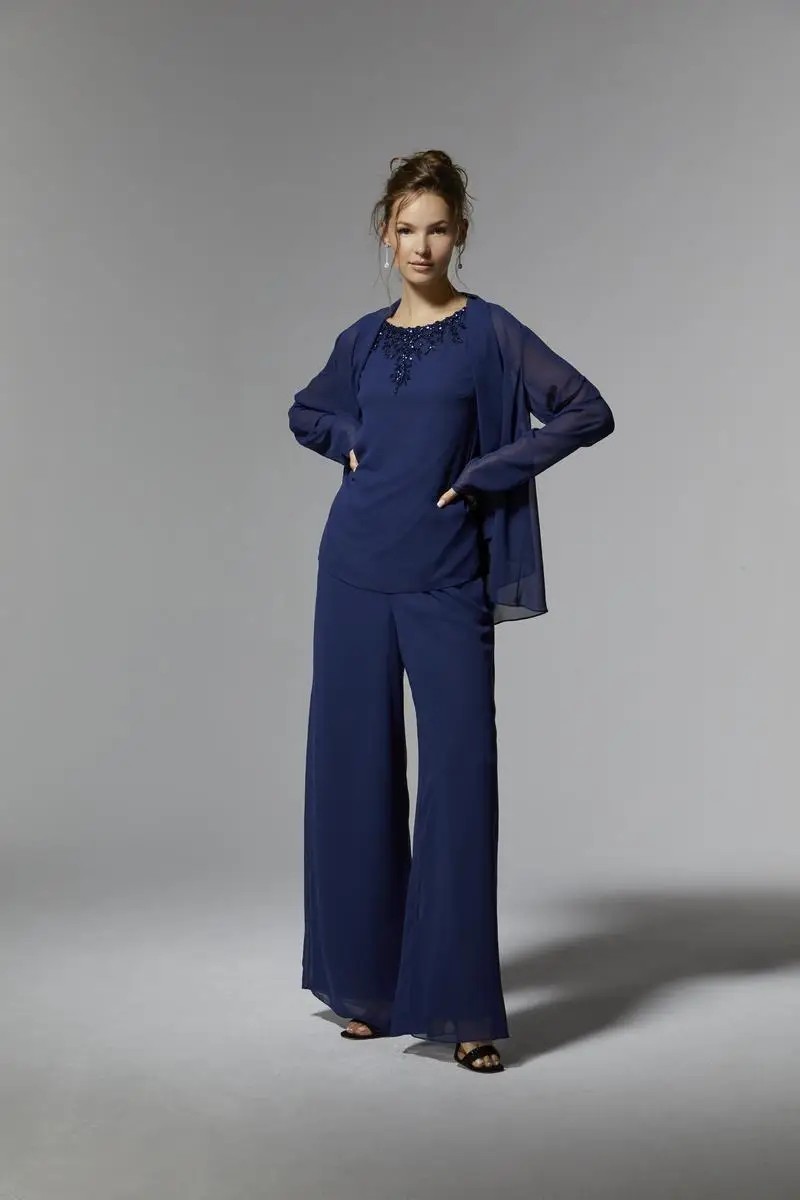 Model is wearing a three piece chiffon pant suit mothers outfit from morilee