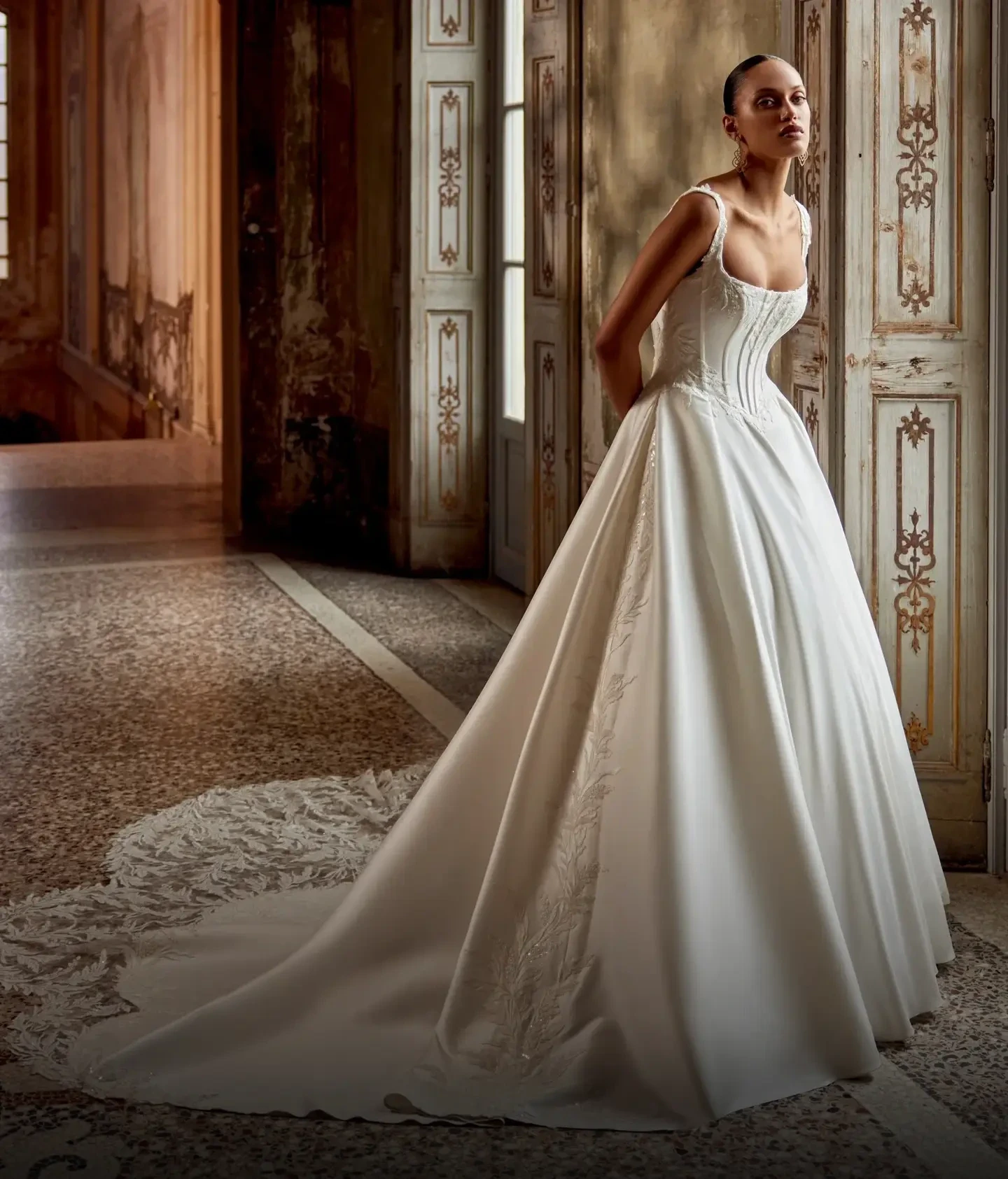 Model wearing a ballgown style dress