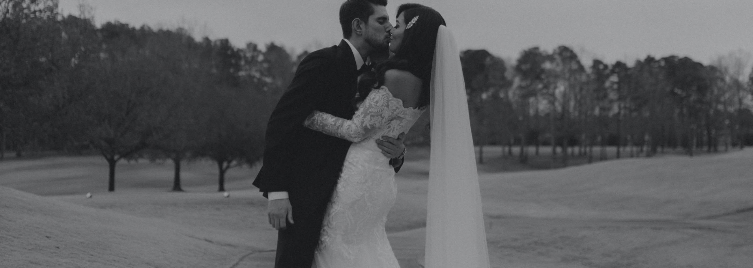 Сouple wearing a white gown and a black suit