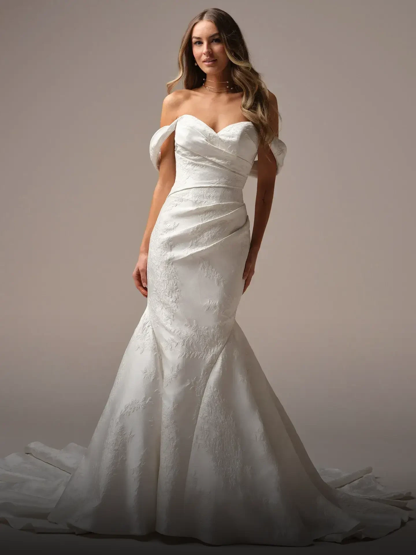 Model wearing a mermaid style dress